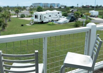 Galveston Island RV Park - Provided Shaded deck with chairs for lounging on clubhouse.